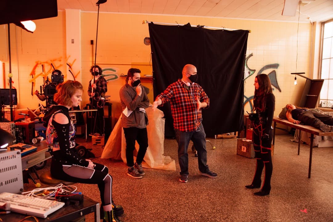 Behind the scenes photo 64 from Clone Cops production showing cast and crew block a scene for clone cops